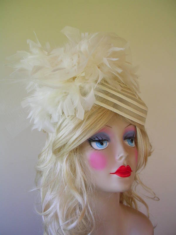 This fabulous sheer half hat or cocktail hat is embellished with 